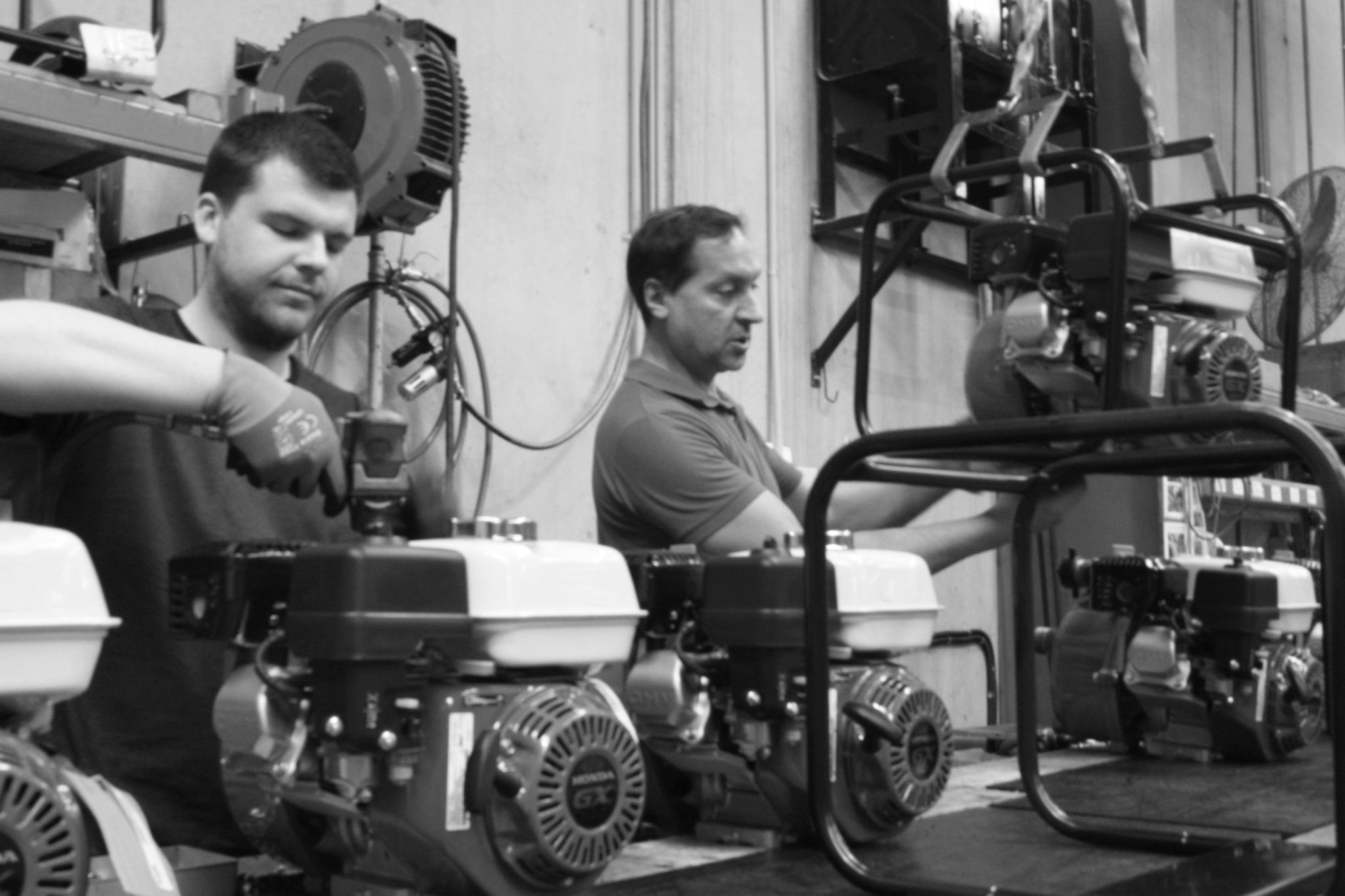 Edited Workers assembling pumps